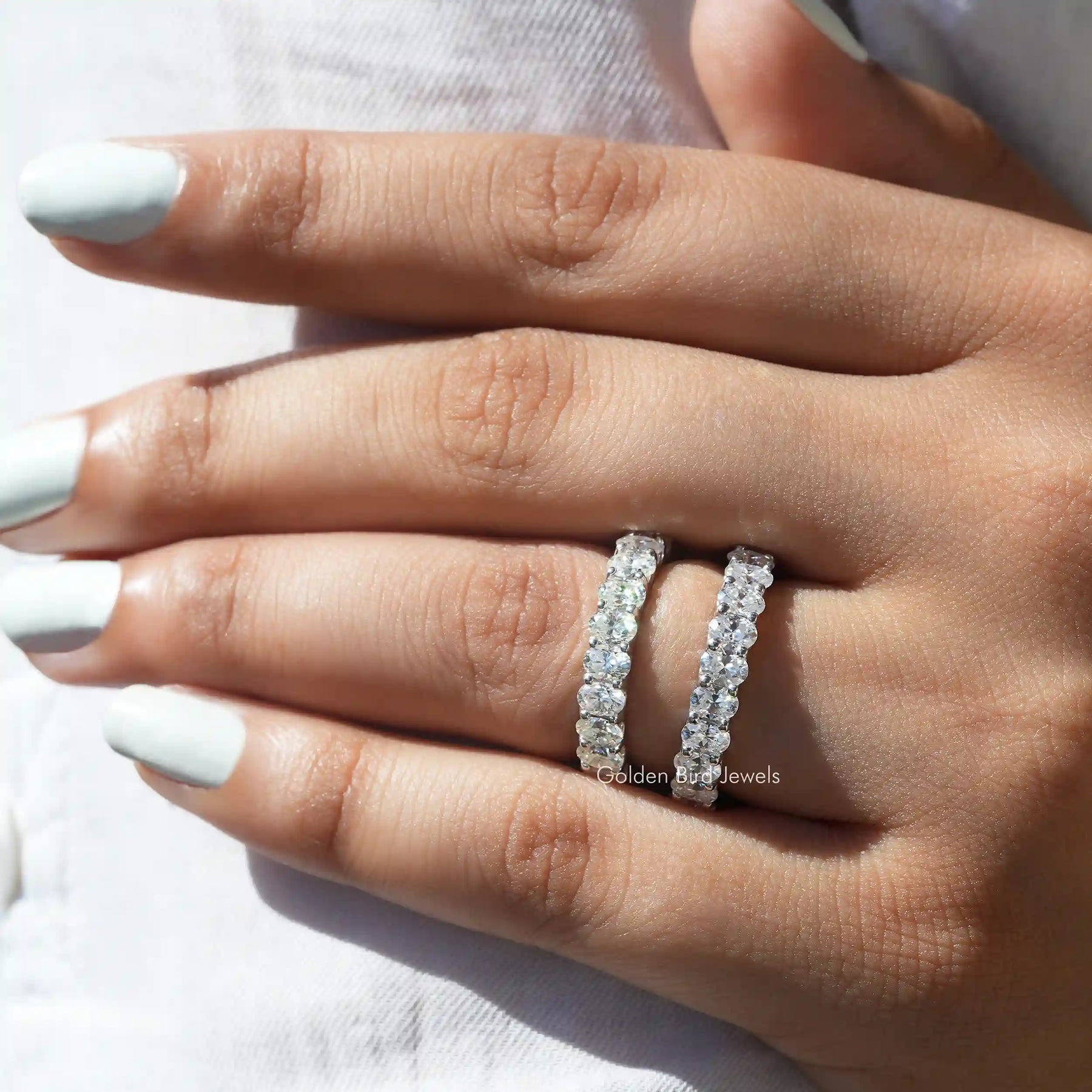 [This moissanite wedding band crafted with oval cut stones]-[Golden Bird Jewels]