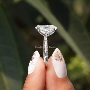 Side View of Oval Cut Moissanite Ring  In two fingers