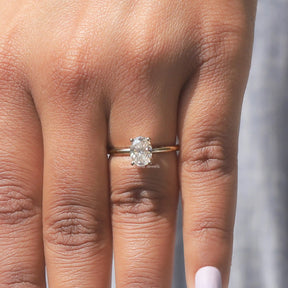 Close-Up View of Oval Cut Moissanite Ring In Yellow Gold