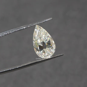 In Tweezer View Of Moissanite Old Mine Pear Cut Loose Stone