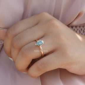 View of Pear Cut Moissanite Solitaire Engagement Ring In Finger