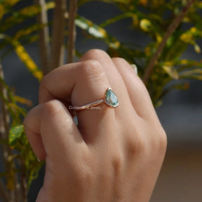 Detailed View Of Pear Cut Moissanite Engagement Ring In Yellow Gold