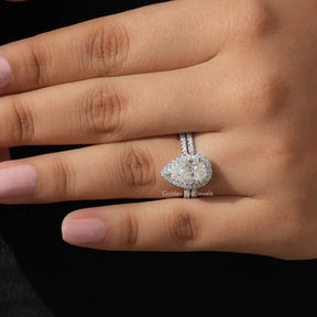 In finger Close view of Pear Cut Moissanite Halo Bridal Ring Set 
