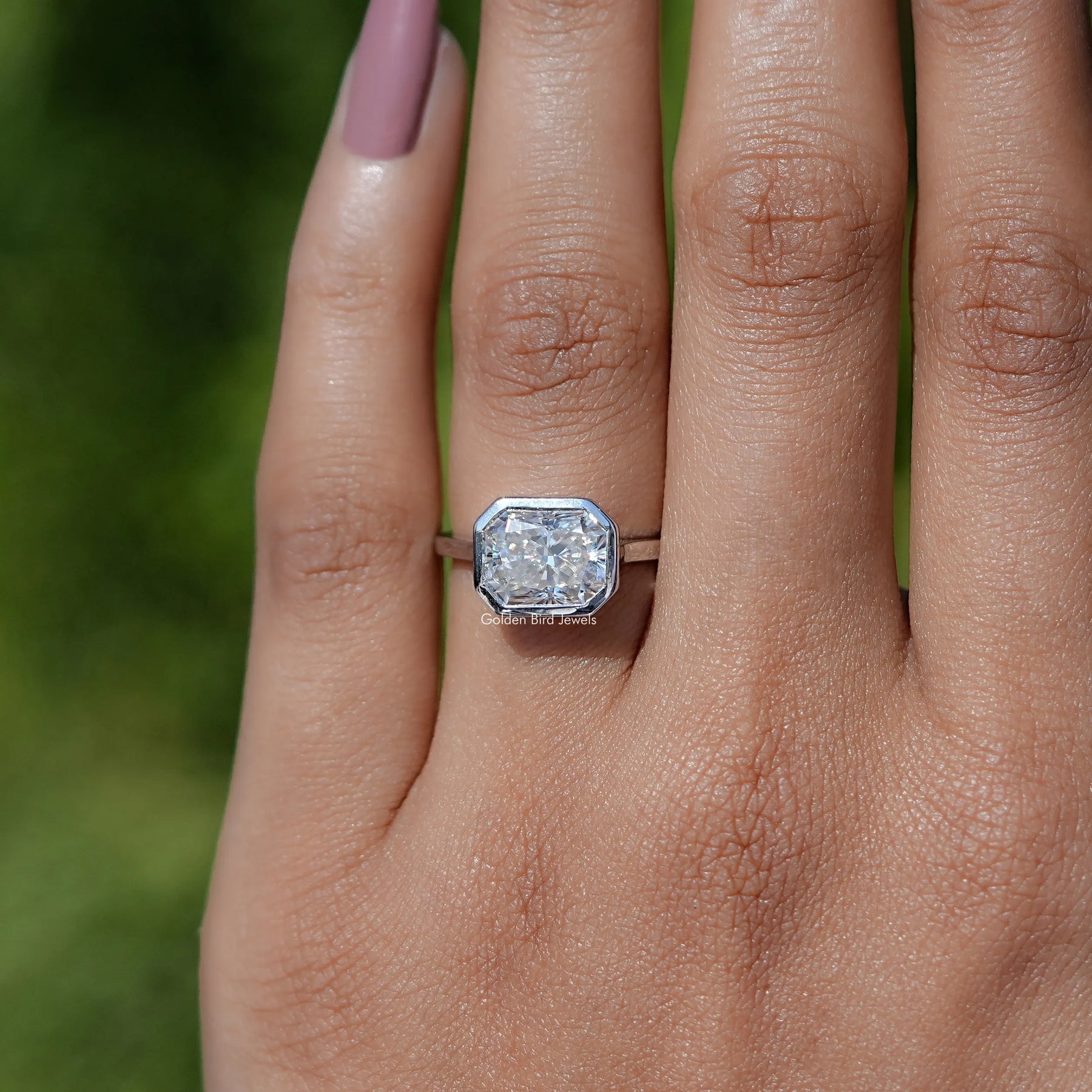 In finger view of Radiant Cut Moissanite Solitaire Ring