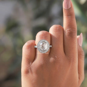 Detailed View Of Oval Cut Halo Engagement Ring In White Gold