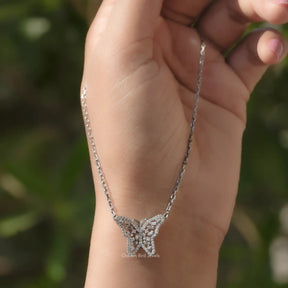 In hand showing view of moissanite pendant	 		