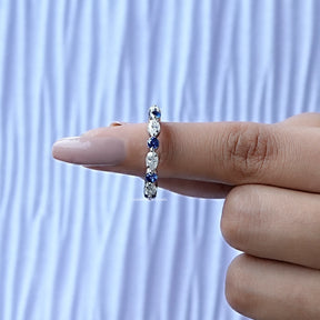 In finger front View of Moissanite Marquise And Round Cut Band In White Gold