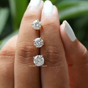 In finger back view of  3 types of moissanite stud earings  