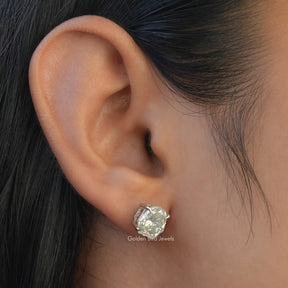 Close view of Moissanite stud earings in shield cut 