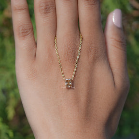 Back view of Emerald Cut Moissanite Solitaire Ring in secure setting 