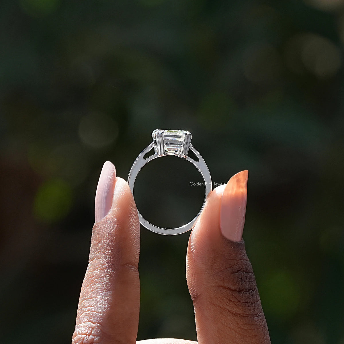 Back View of Asscher Cut Moissanite Solitaire Ring In two fingers
