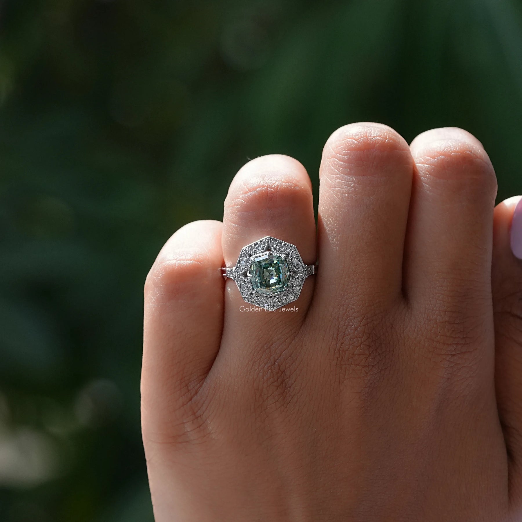 Close-Up View of Green Step Cut Cushion Moissanite Ring In White Gold