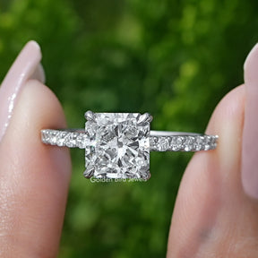 Square Radiant Cut Diamond Solitaire Ring Held Between Fingers