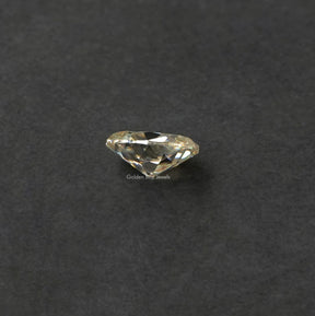 Side view of off white old mine oval cut moissanite 