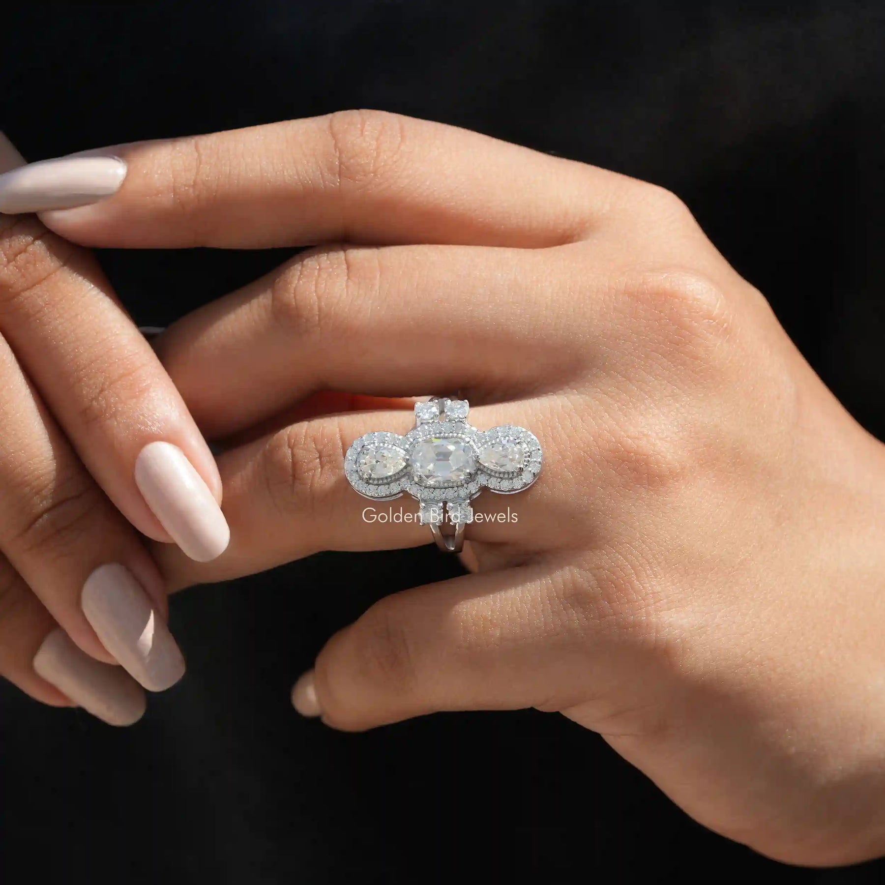 View of Old Mine Cushion And Pear Moissanite Ring In Finger