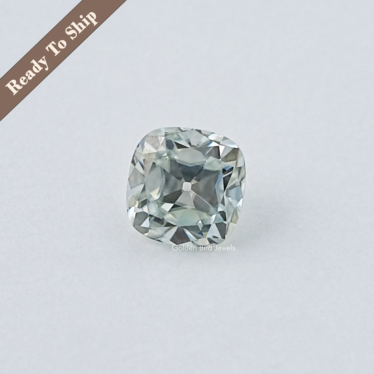 Loose cushion-cut light blue gemstone with faceted rectangular shape