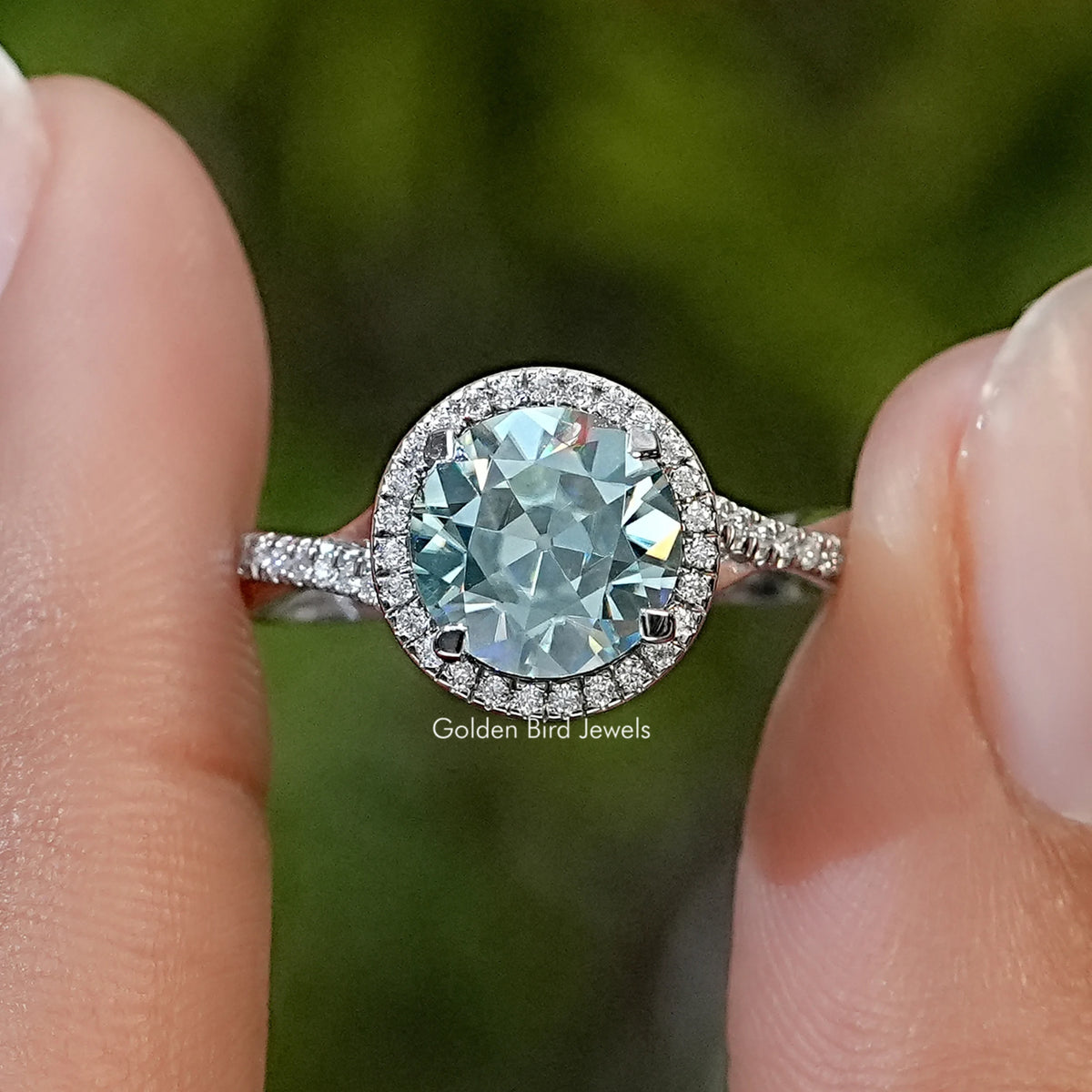 Round moissanite halo ring with twisted pavé band in sterling silver