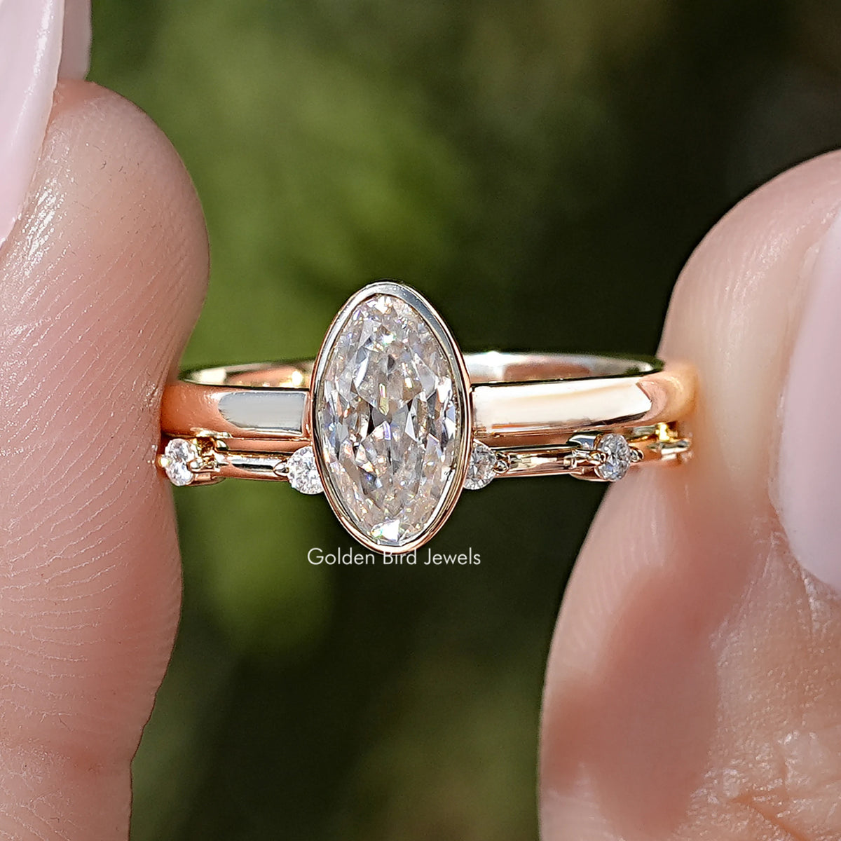 Gold-toned oval moissanite solitaire ring set with slim side-stone bands