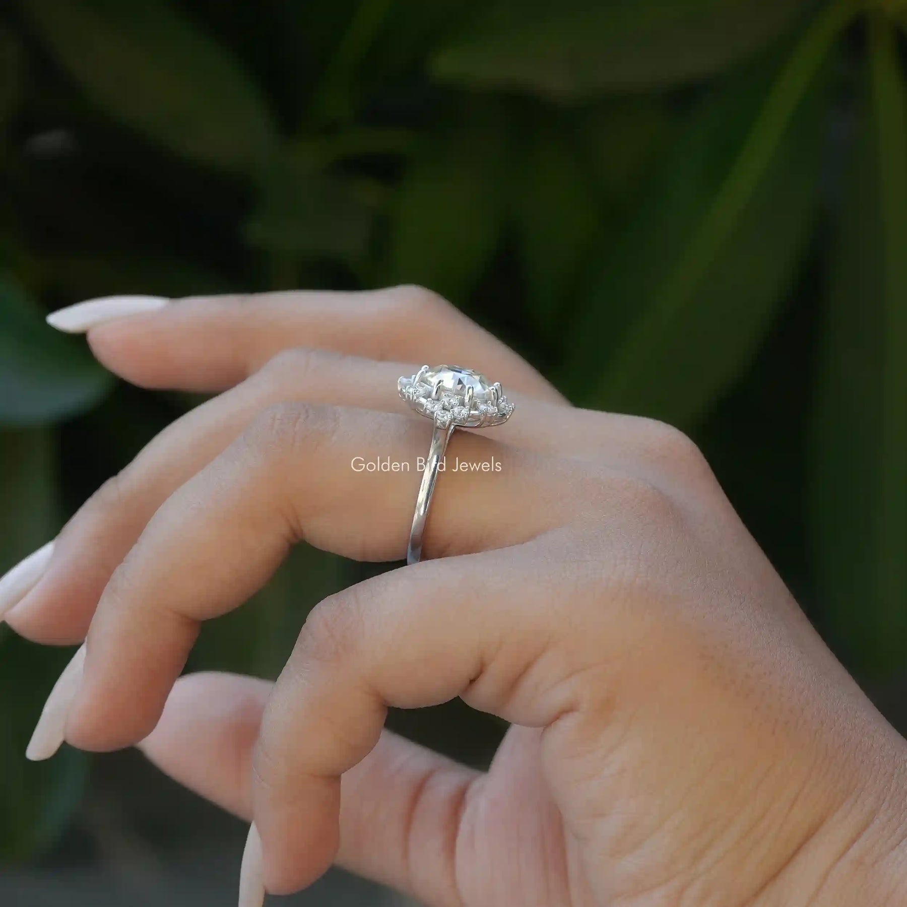 Side View of Round Cut Moissanite Engagement Ring In finger