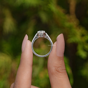 Back View of Round Cut Moissanite Solitaire Ring In two fingers