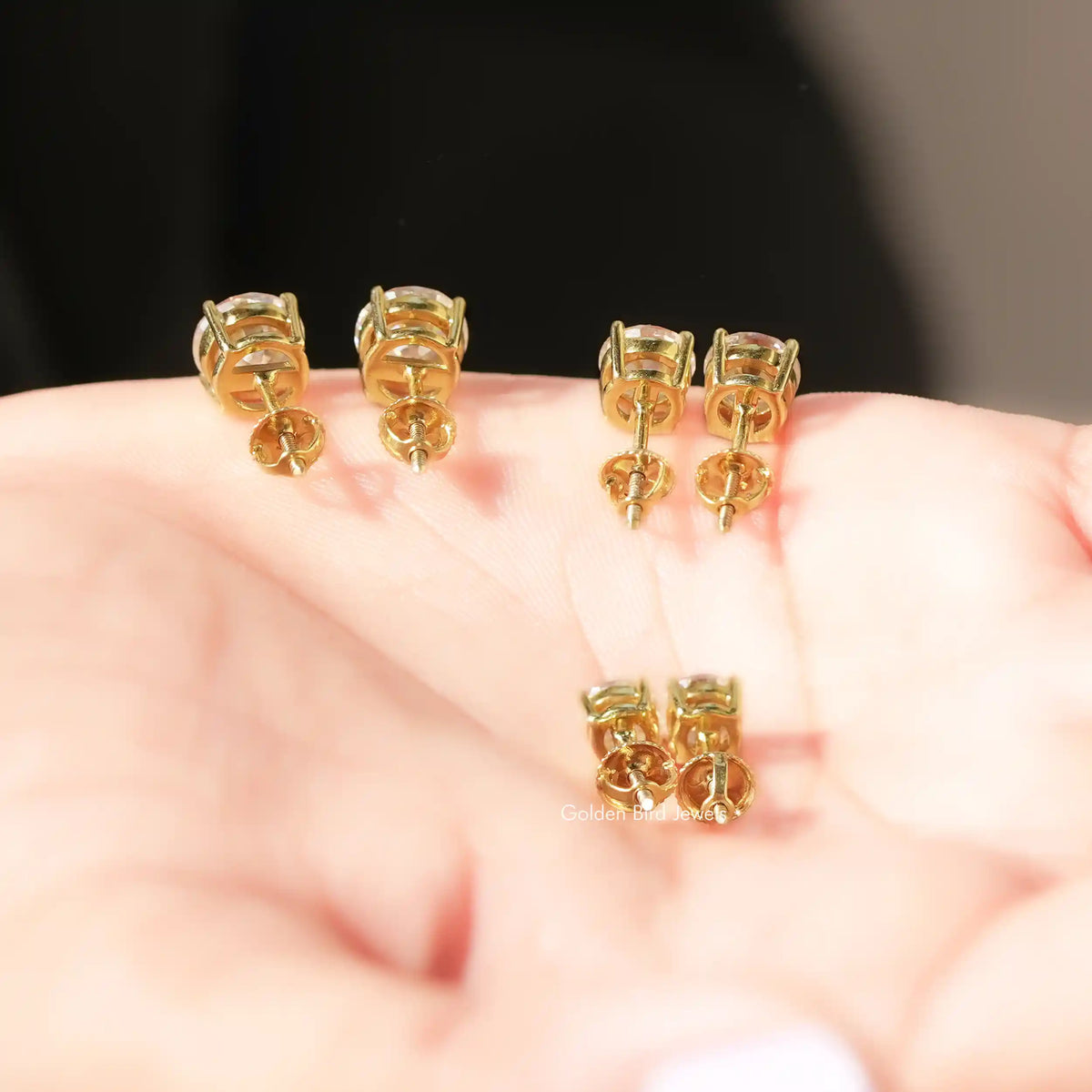 Back  View Of Round European Cut Moissanite Stone earrings in a secure setting 