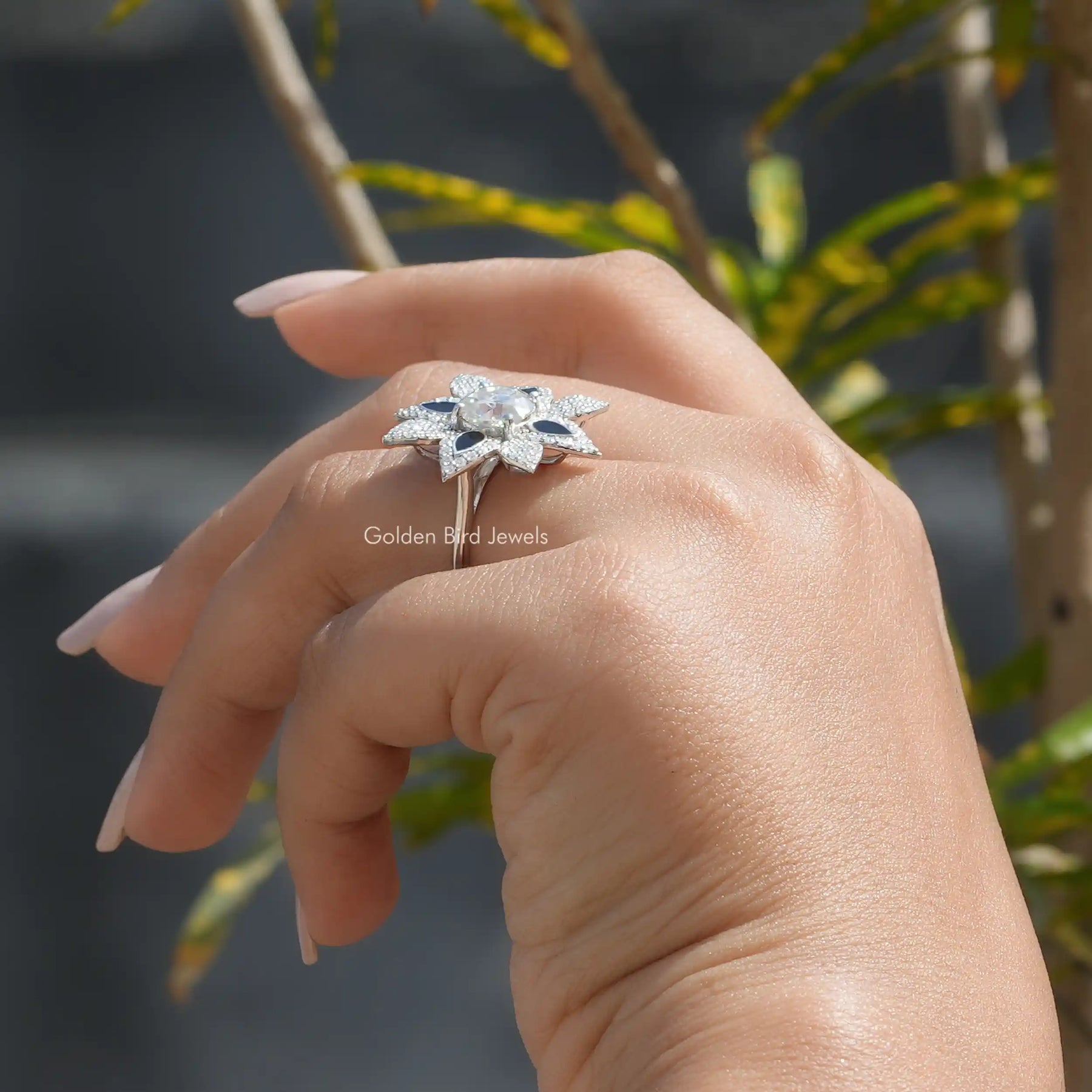 Side View of Round Cut Moissanite Floral Ring In finger