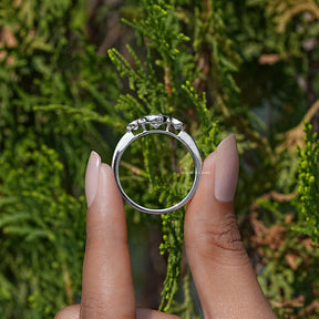 Back View of Old European Round Cut Diamond Three Stone Engagement Ring In two fingers