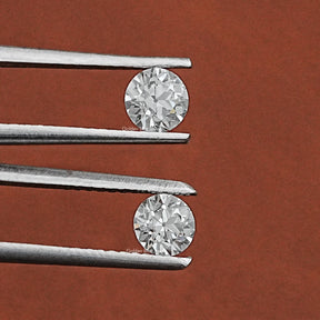 Tweezer holding the Old European Round Shaped Loose Diamond Pair