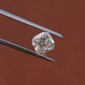 Twijer holding in the Old Mine Cushion Cut Loose Stone In White Gold