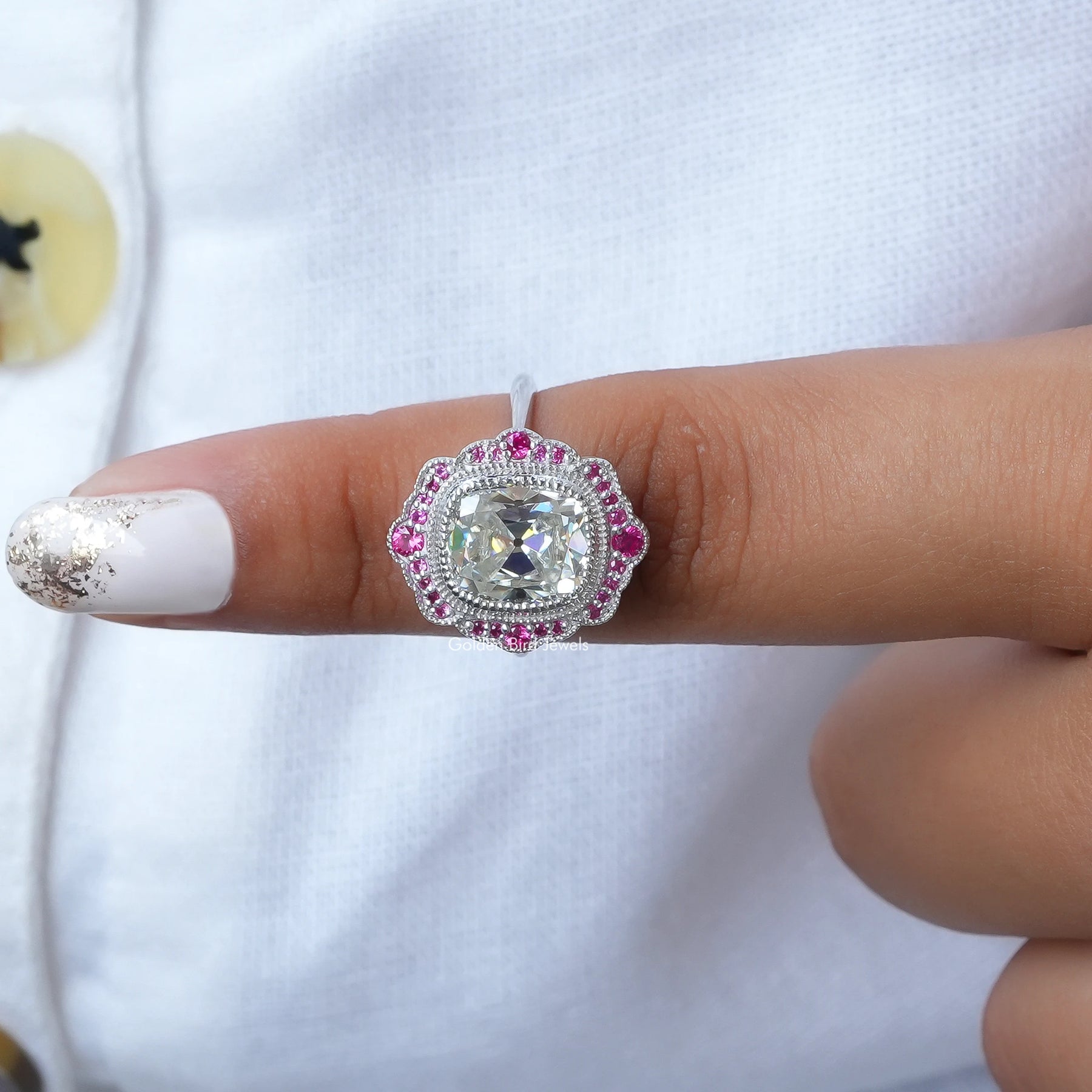 In finger front View of Cushion Cut Moissanite Engagement Ring In White Gold
