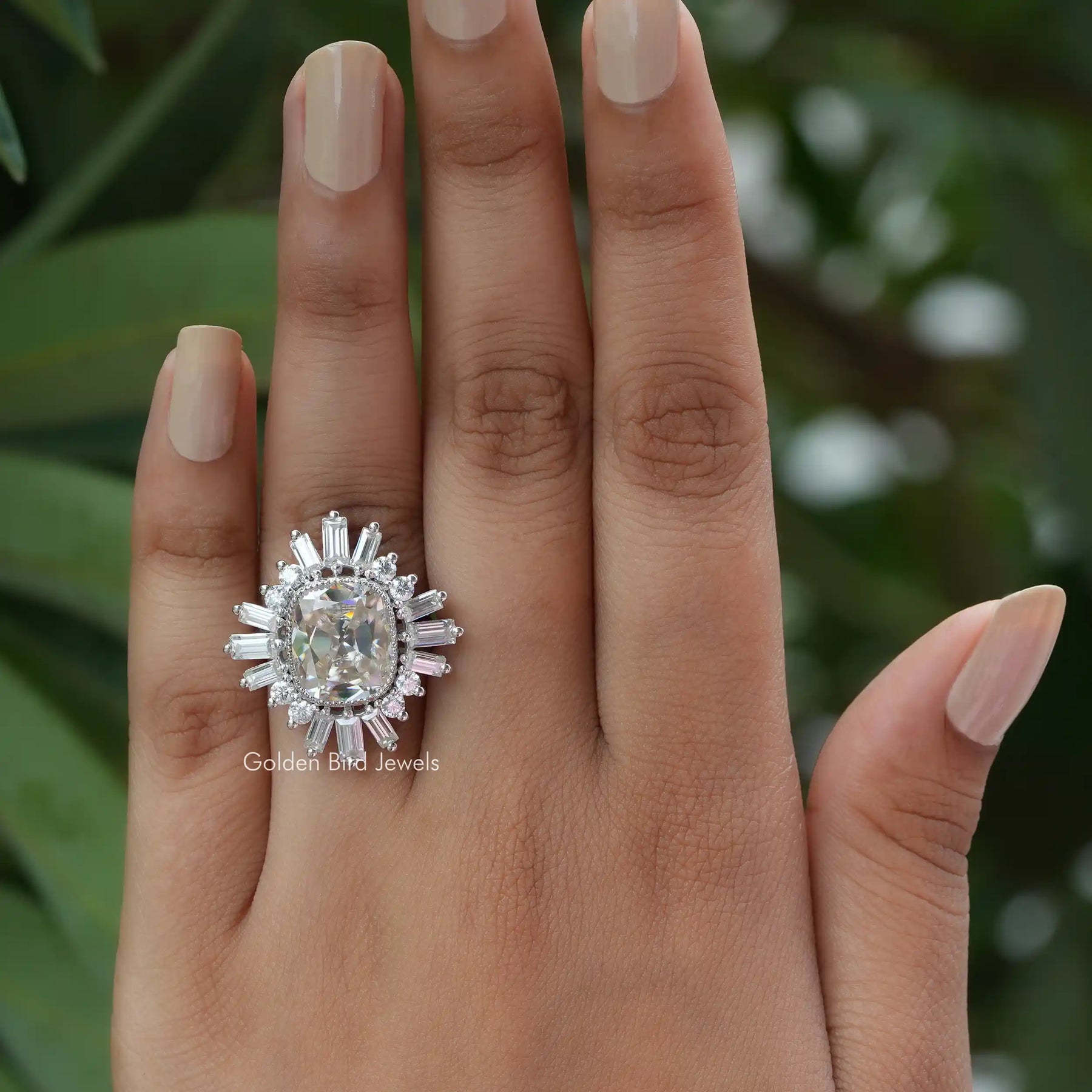 View of Baguette And Round Cut Halo Moissanite Engagement Ring In White Gold