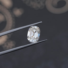 In Tweezer View Of Old Mine Cushion Cut Moissanite Loose Stone
