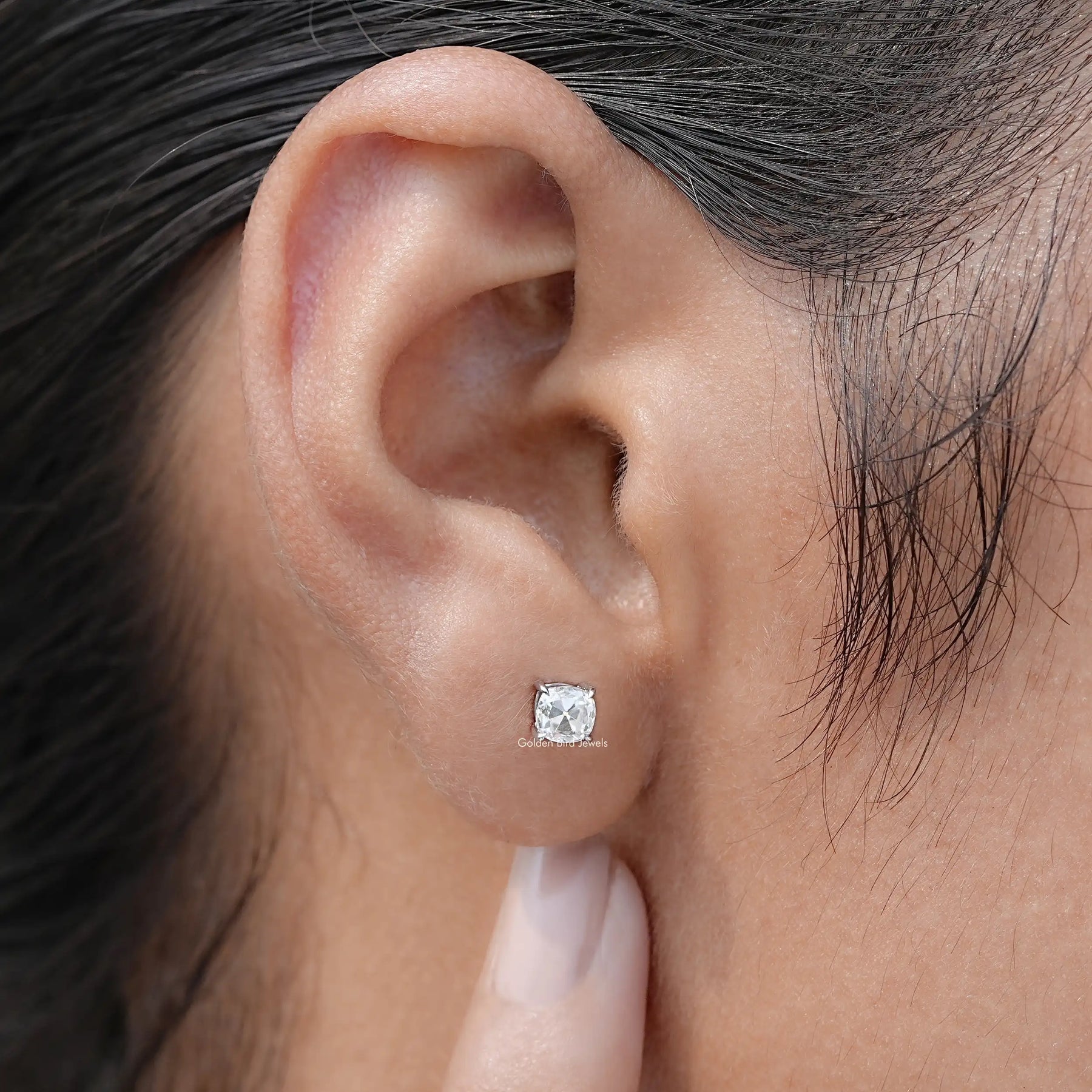 Front view of cushion shaped moissanite stud earrings