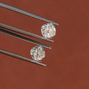 In Tweezer View Of Moissanite Cushion Shaped Loose