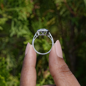 Back View of Cushion Cut Moissanite Halo Ring In two fingers