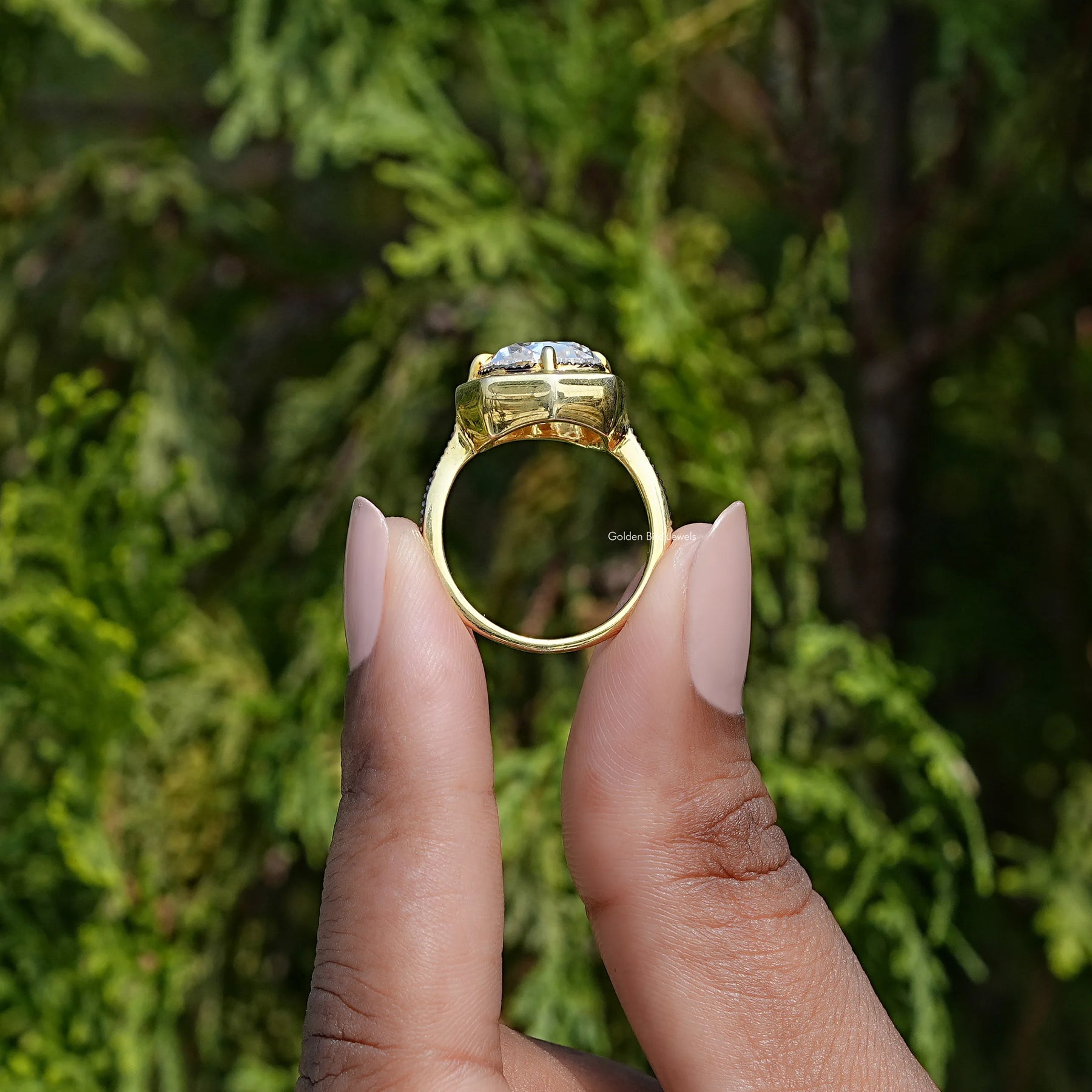 Side view of cushion cut moissanite Ring in yellow gold
