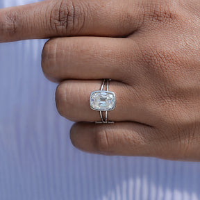 Close view of moissanite ring in secure setting 
