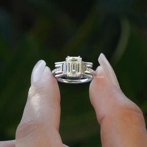 Front View of  Old Mine Emerald Cut Moissanite Ring In two Fingers