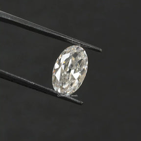 In Tweezer View Of Near Colorless Oval Cut Loose Stone