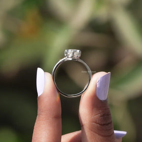 Back view of pear white stone ring in secure setting 
