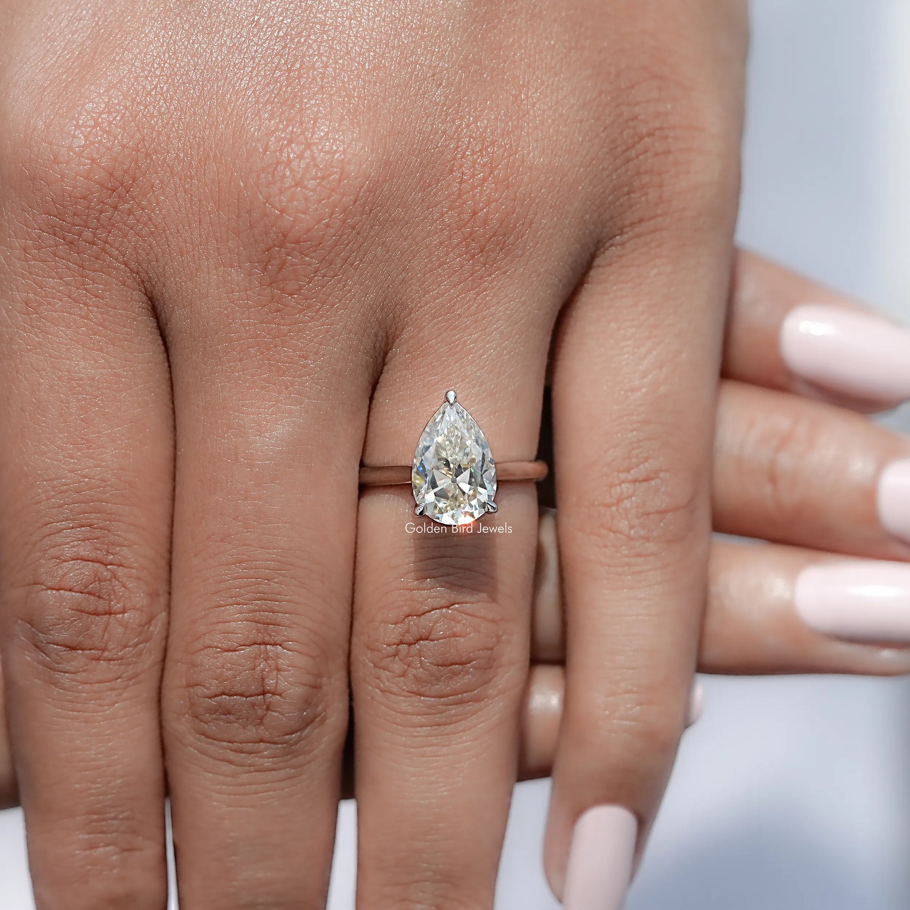 View of Pear Moissanite Engagement Ring in prongs setting 