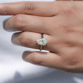 In finger front view of Pear Moissanite Engagement Ring in unique shape