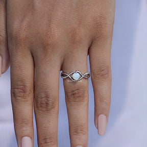 View of Opal Round Cut Gemstone Infinity Style Accent Ring In White Gold