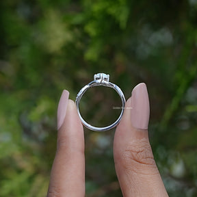 Back View of Opal Round Cut Infinity Accent Stone Ring In two fingers