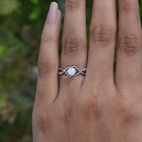 Detailed View Of Round Cut Infinity Ring With Round Cut Side Stones