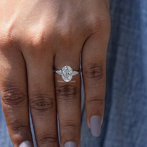 View of Pear Cut Moissanite 3 Stone Engagement Ring In White Gold