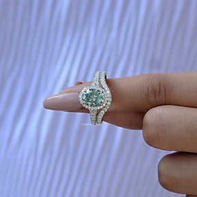 In finger front View of Oval And Round Cut Halo Ring