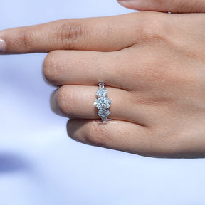 In finger front view of Oval And Tapered Baguette Cut Lab Diamond Five Stone Ring In White Gold