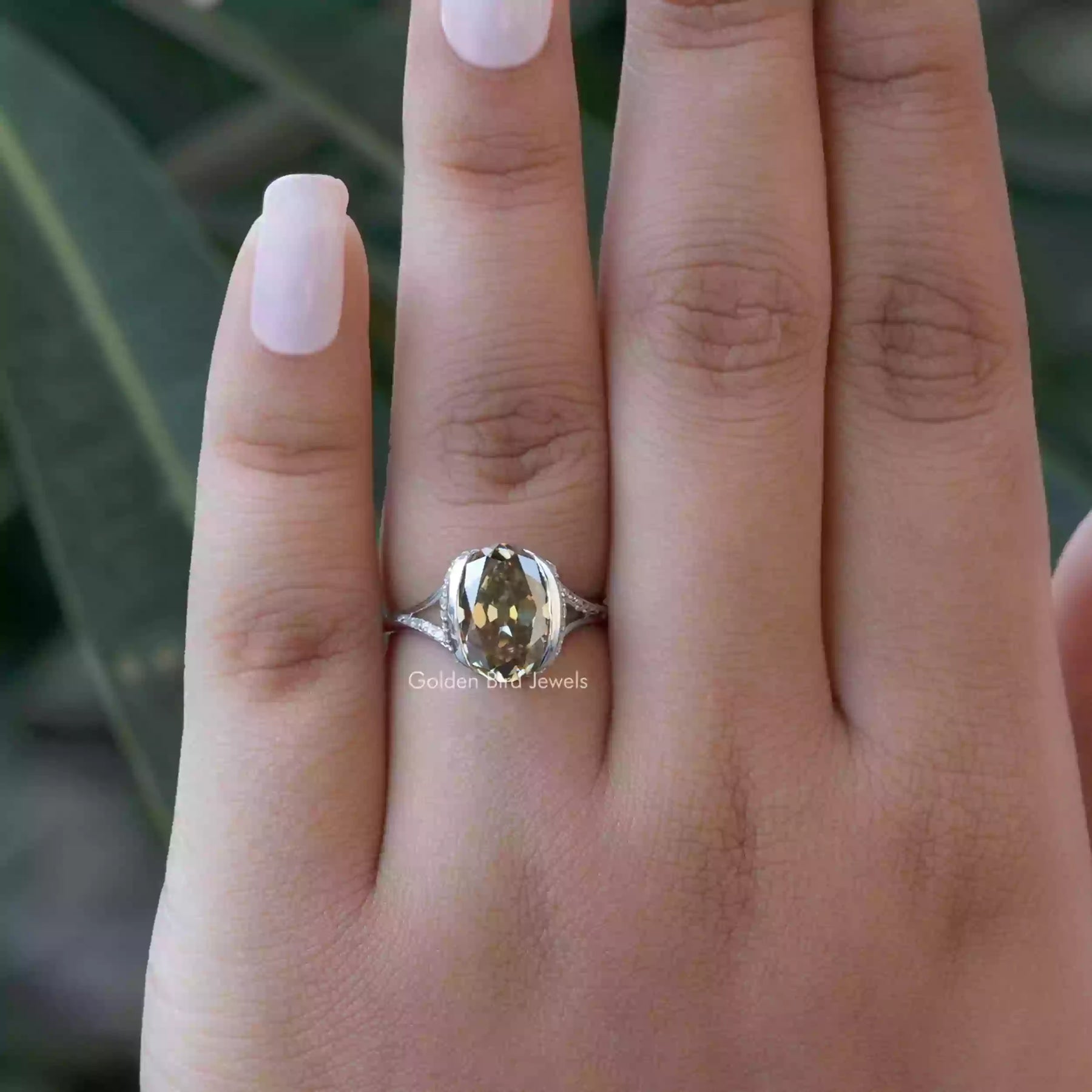 Detailed View Of Brown Oval Cut Bezel Set Ring