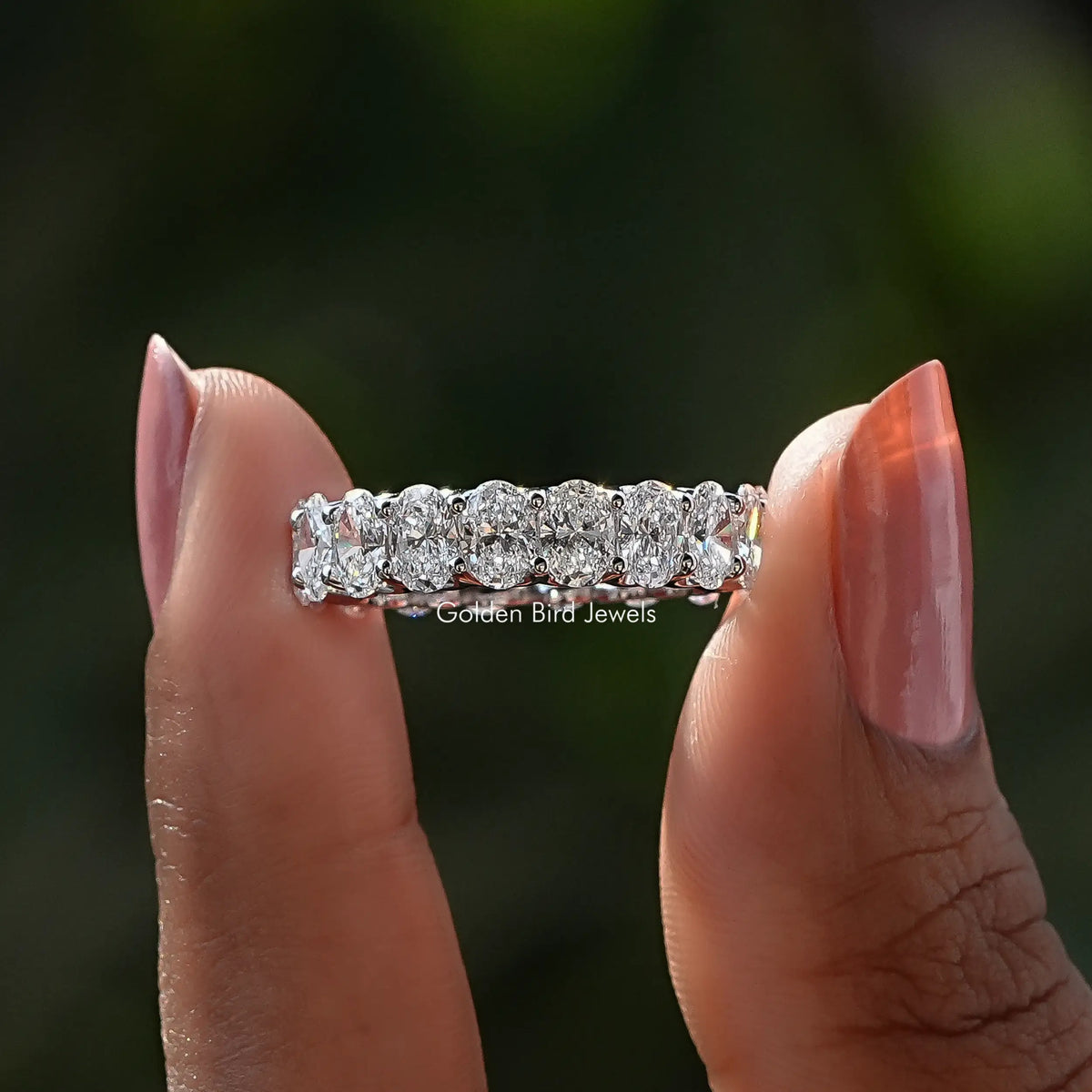 Front View of Oval Cut Diamond Eternity Wedding Band In two Fingers